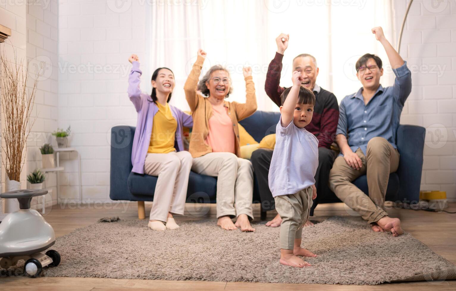 Happy multi-generational Asian family enjoying quality time together at home,2 photo