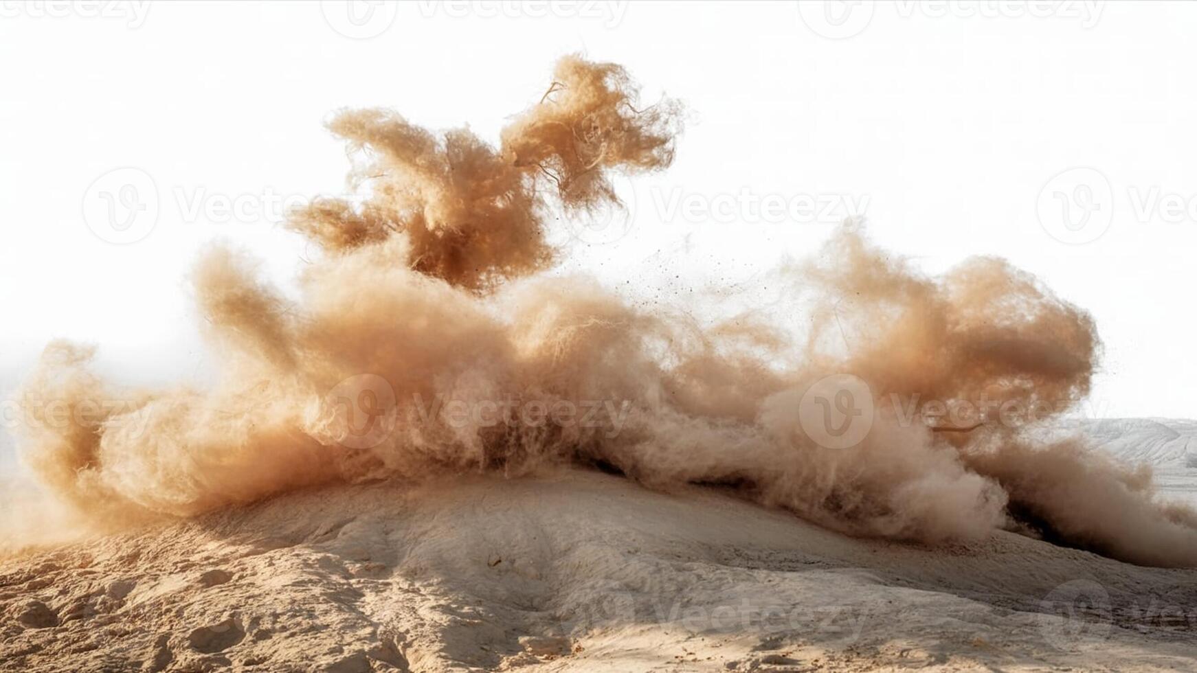 A large cloud of dust and sand rising from the ground against a bright white background photo