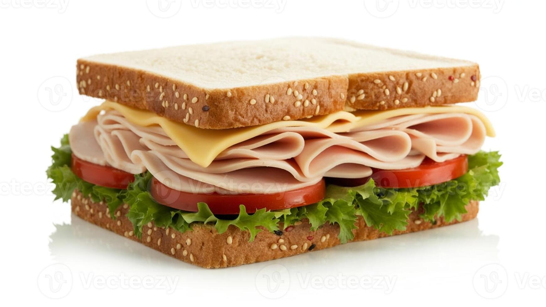 A close up shot of a sandwich with ham cheese lettuce and tomato on a white background surface photo