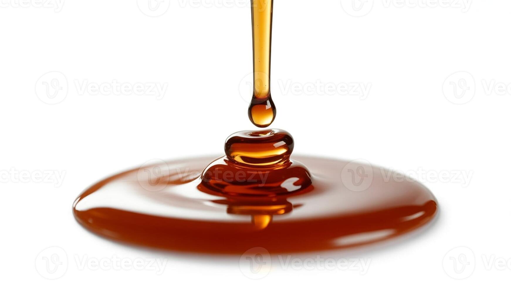 Close up shot of caramel syrup pouring onto a surface with a white background visible behind it photo