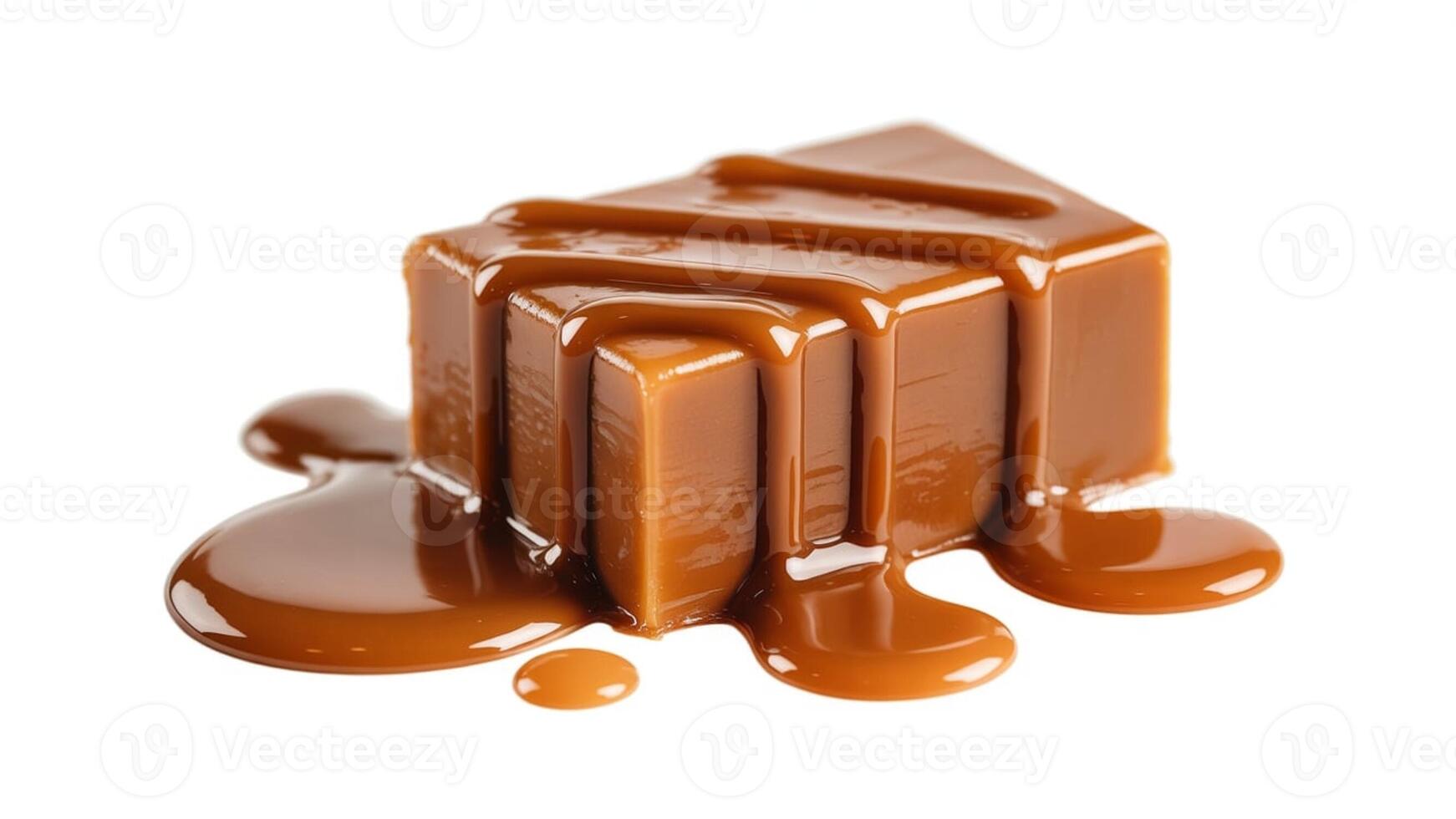 Close up of a caramel candy square with caramel sauce dripping on a white background photo