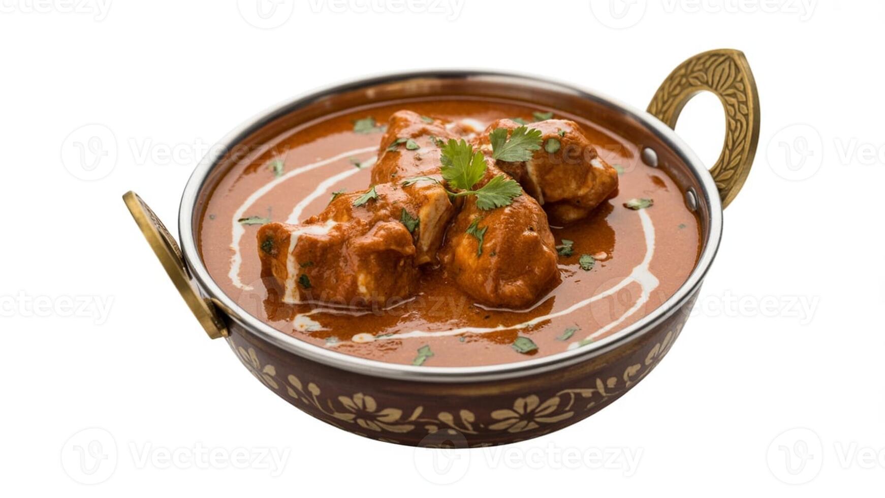 Close up of butter chicken in a metal bowl with cream and cilantro garnish isolated photo