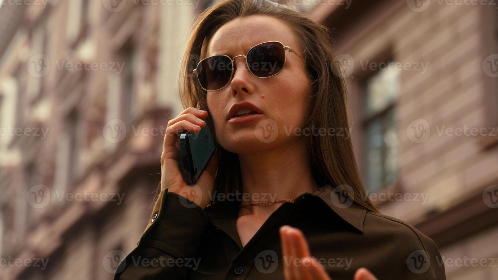 Close up unhappy irritated Caucasian woman talking arguing mobile phone lost in city looking around using navigator female problem talk smartphone GPS application error girl worry searching location photo