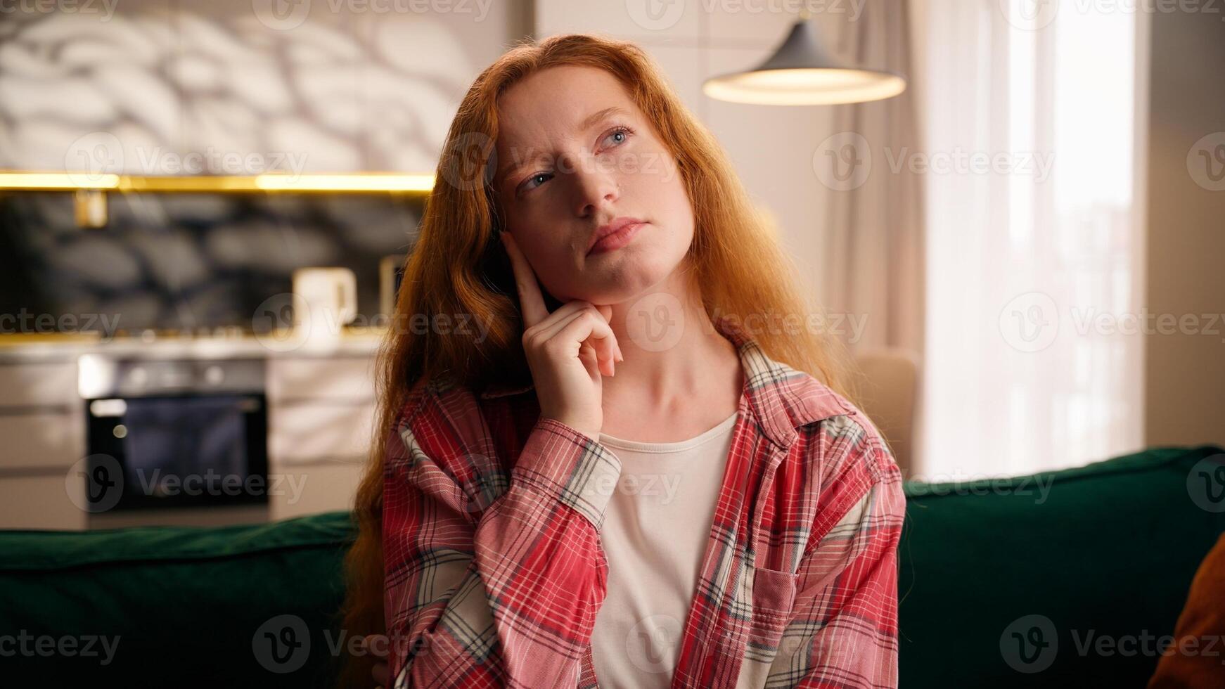 Pensive woman thinking at home creative girl think solution planning decide idea indoors female puzzled at couch in living room creating decision confused hesitate deciding question solving portrait photo