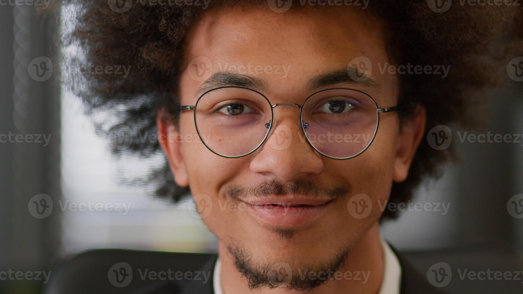 Portrait close up smiling positive headshot indoors African American ethnic business man businessman guy male employer entrepreneur student manager work at office working studying looking at camera photo