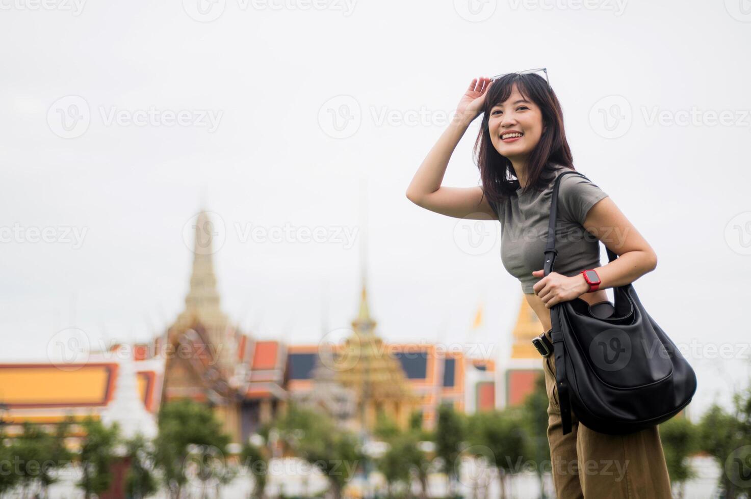 Joyful solo southeast asian woman teenager blogger and world travel explorer. Enjoying local cultural tourism experience in Bangkok, heart of Asia, Thailand. great travel concept photo