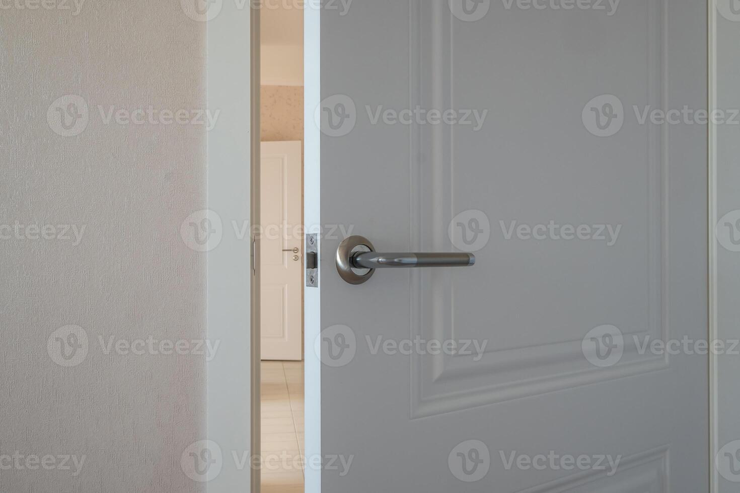 An open door with a handle on it photo