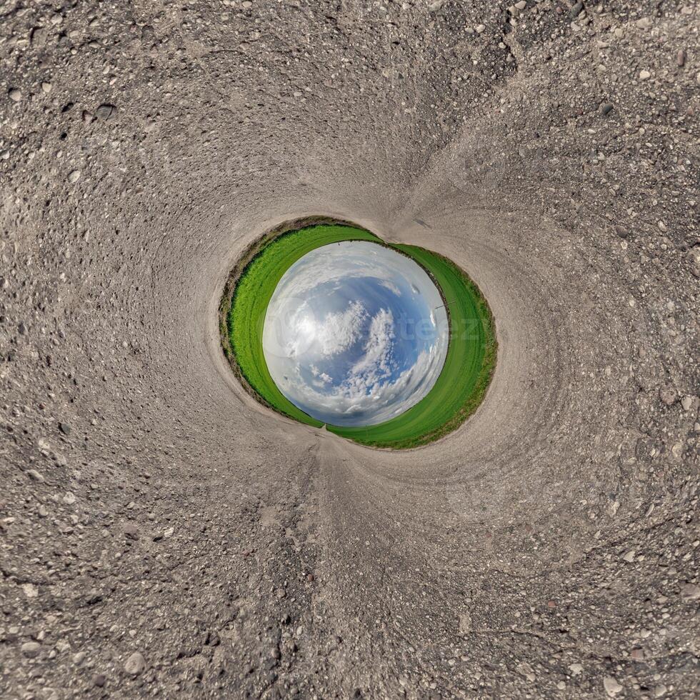A view of a green field from inside a hole photo