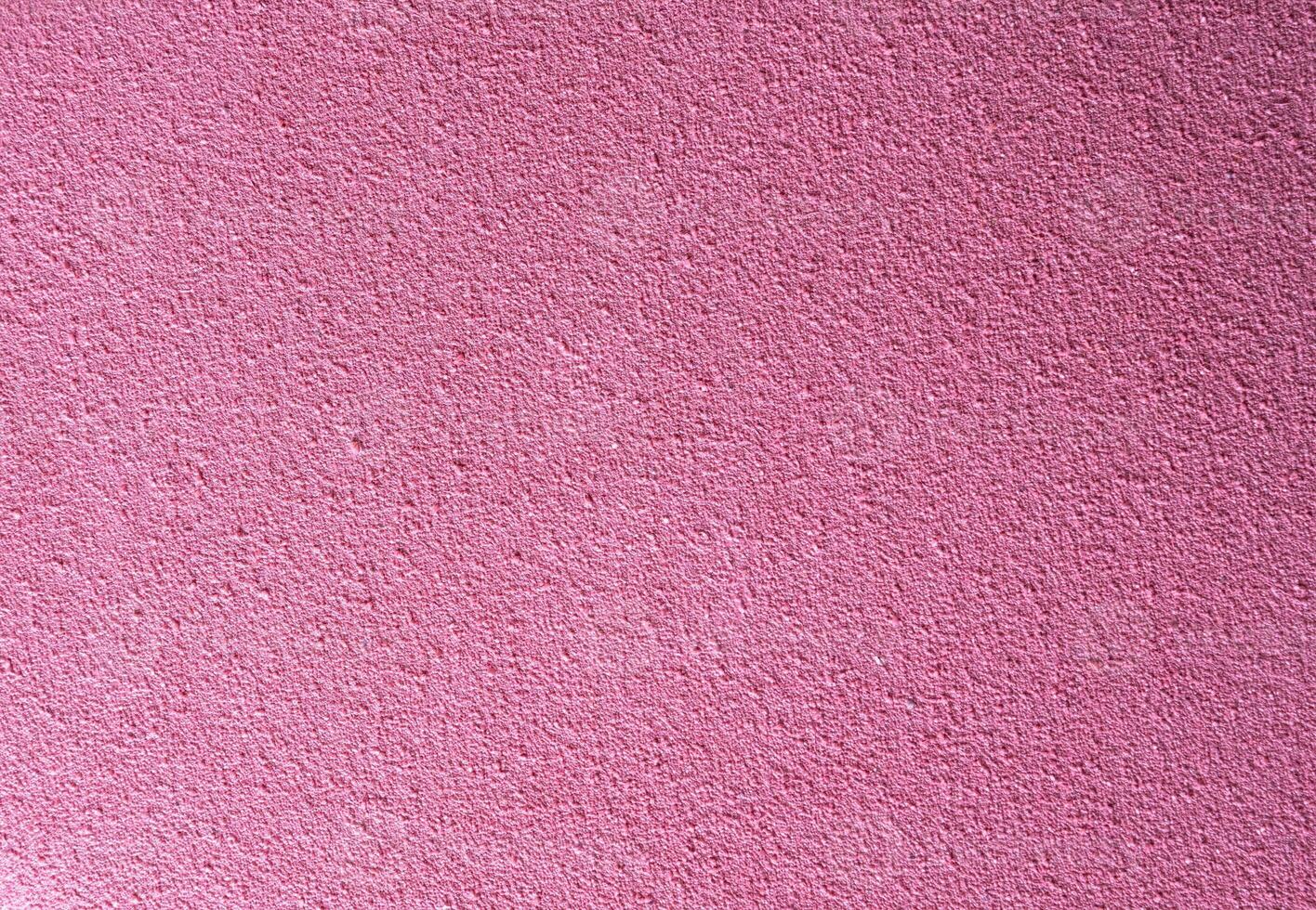 Pink textured surface with rough grain, ideal as a background for creative projects, posters, design templates, or digital graphics with copy space. photo