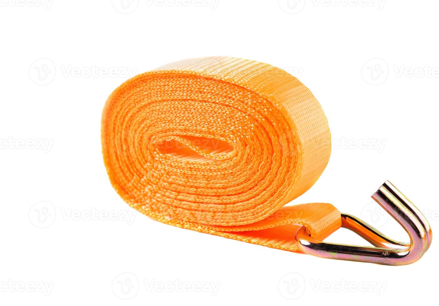 Orange lashing strap with metal ratchet and hook, displayed on clean white background. Used for securing cargo during transport. photo
