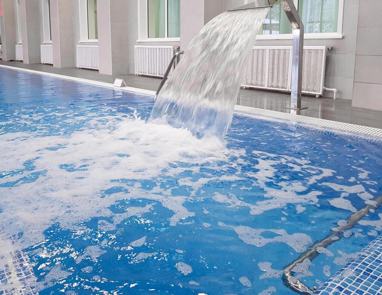 Whirlpool installation in an indoor pool, close-up, for relaxing and massaging the neck and back. photo