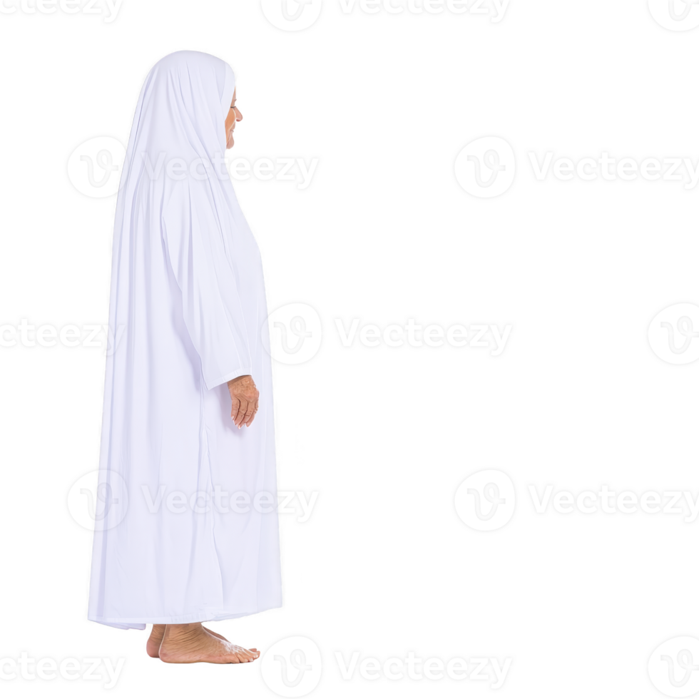 An elderly woman stands in profile, wearing white hijab and robe, symbolizing peace and spirituality. Her serene expression and traditional attire reflect cultural and religious significance png