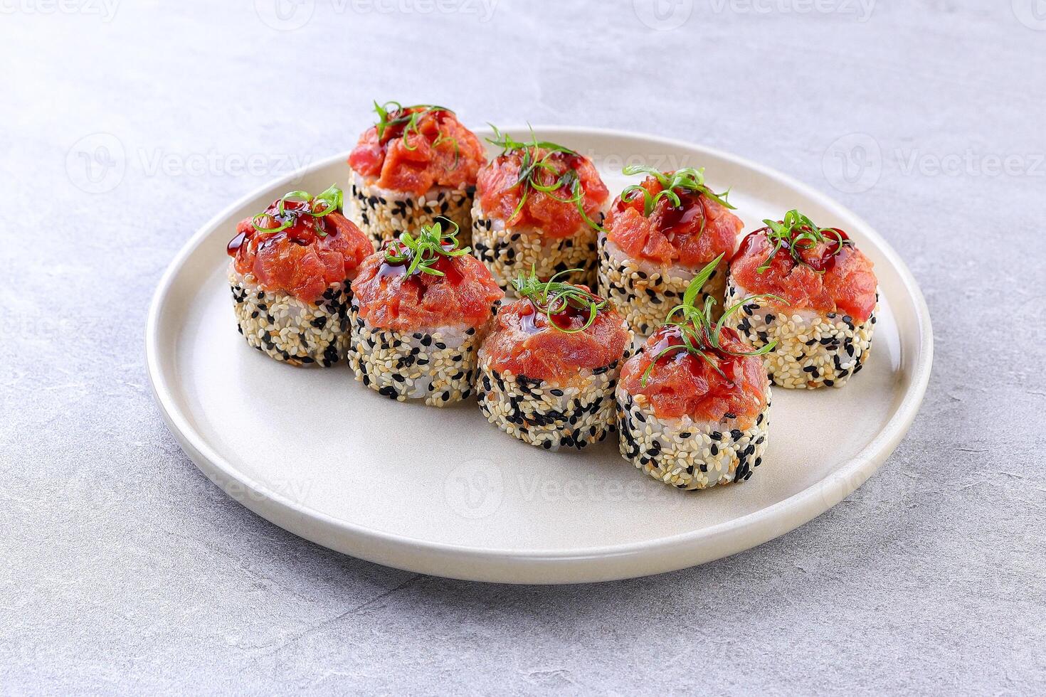 Sesame Crusted Tuna Roll with Spicy Sauce and Scallion Garnish photo