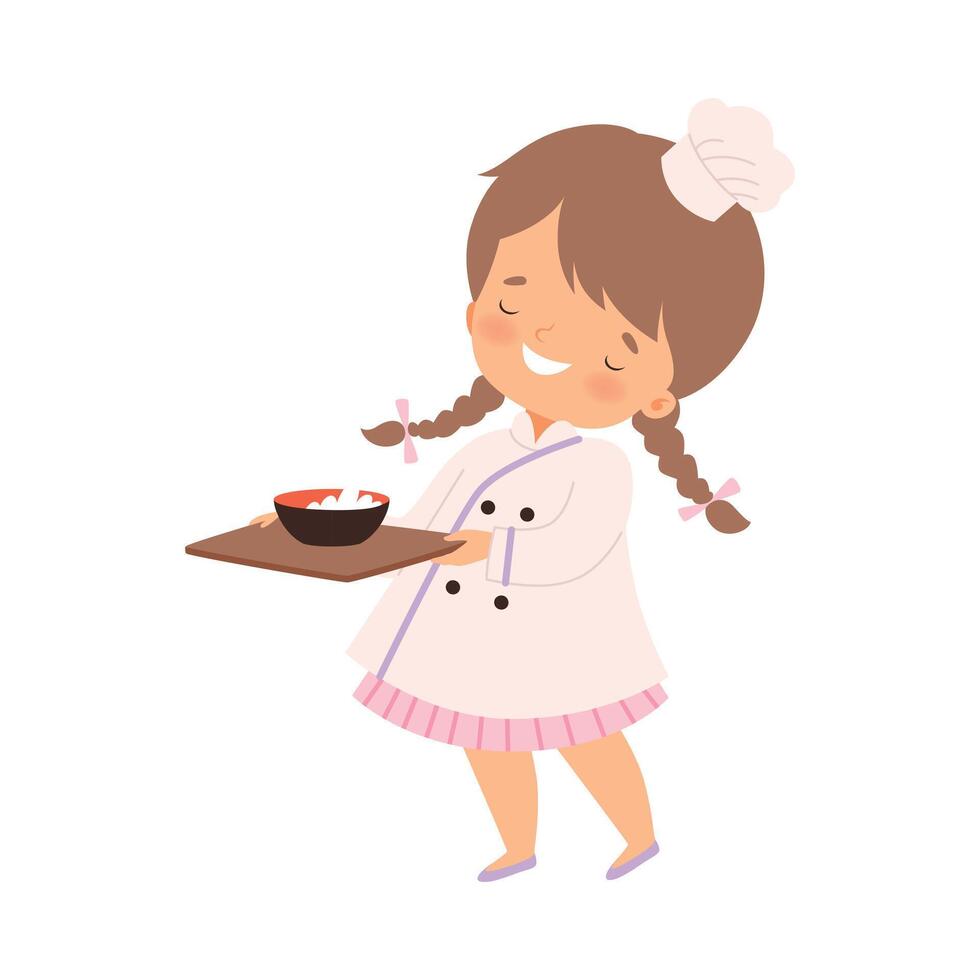 Cute Smiling Girl with Bowl of Freshly Prepared Meal, Cute Little Chef Character in Uniform Cooking in the Kitchen Cartoon Style Illustration vector