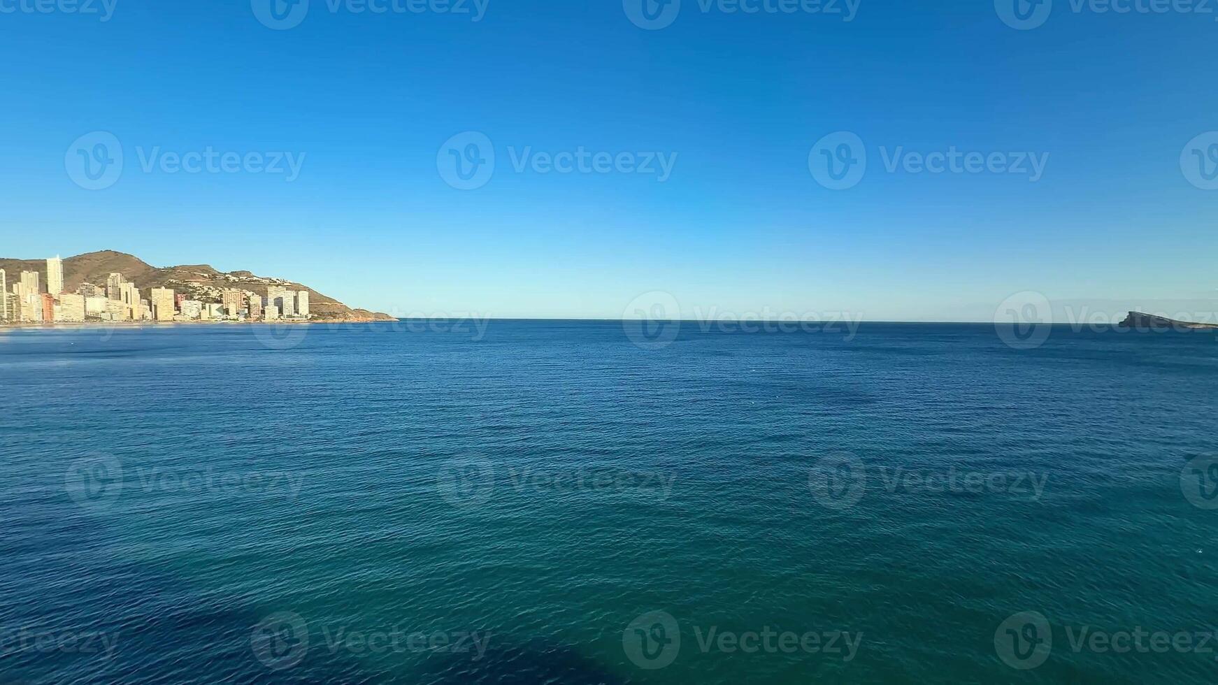 Stunning and gorgeous panoramic shots showcase tranquil ocean waters seamlessly merging with the skyline photo
