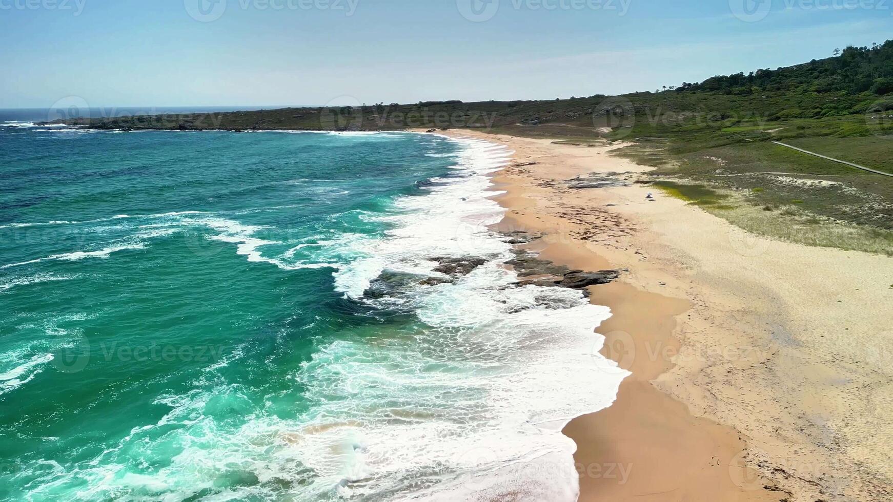 Discover a pristine beach with turquoise waves and golden sands in this breathtaking aerial photograph photo