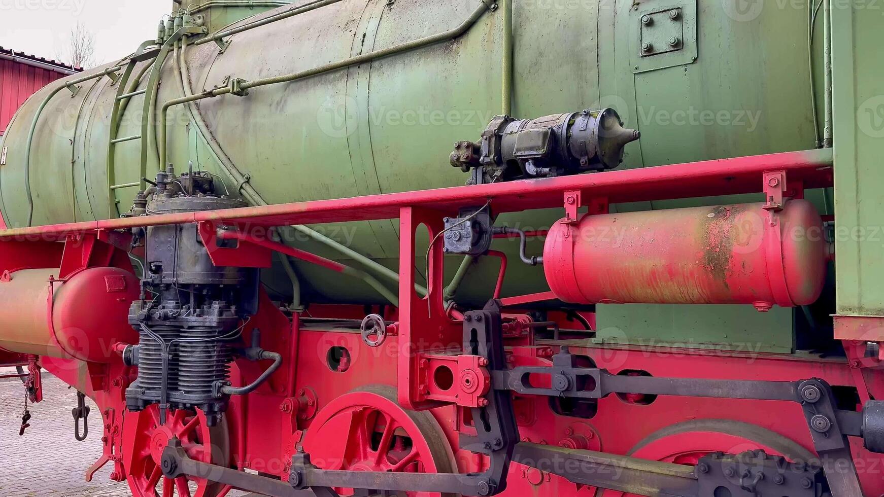 An intricate and detailed view of an old steam locomotive proudly showcasing its vibrant and colorful machinery photo