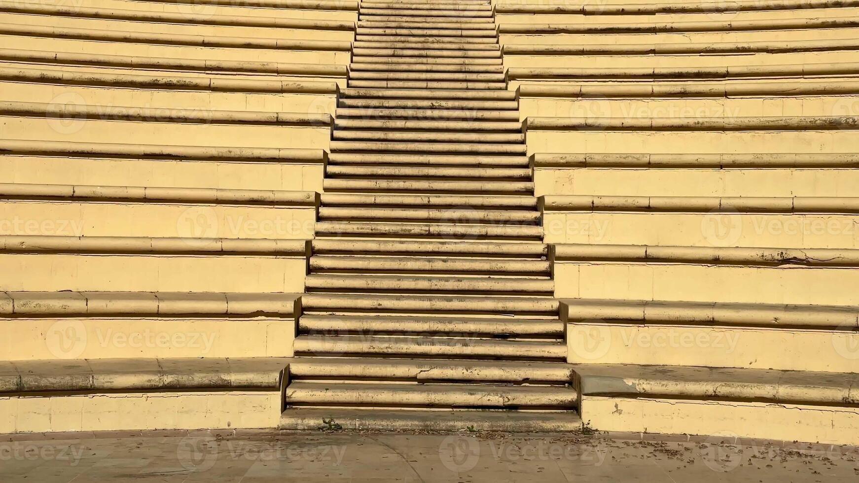 The amphitheater steps, surrounded by lush greenery, create a perfect space for events and gatherings photo