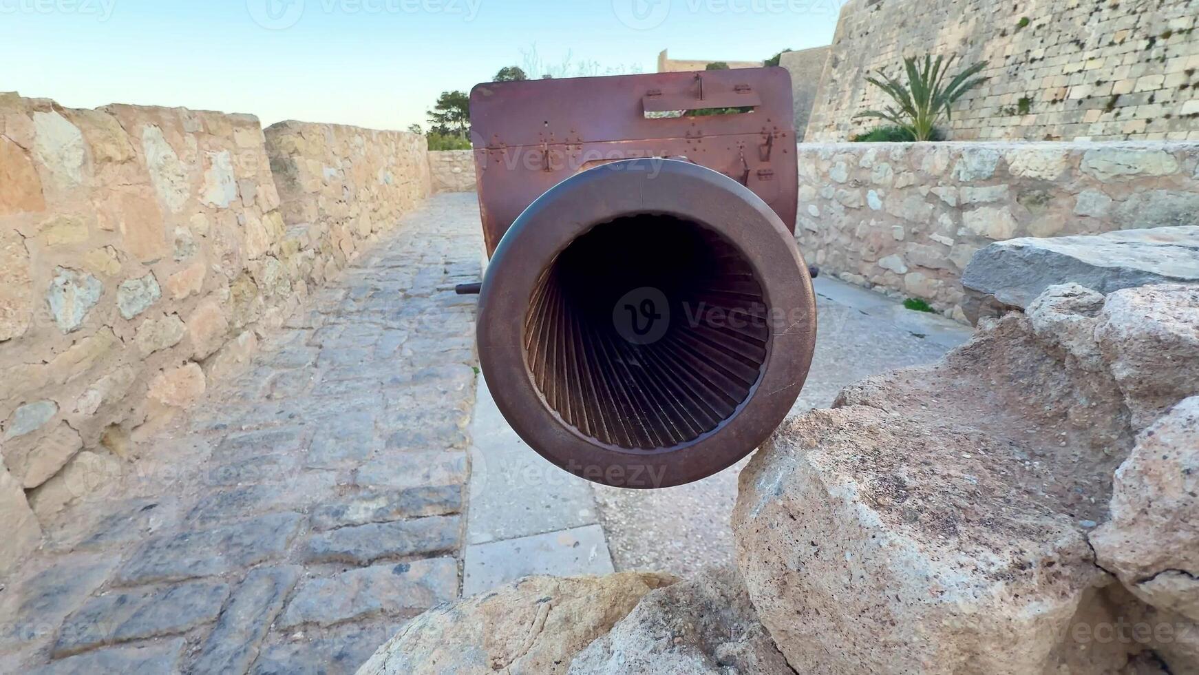 Closeup of a historic cannons ornate barrel in a majestic stone fortress, showcasing its intricate design photo