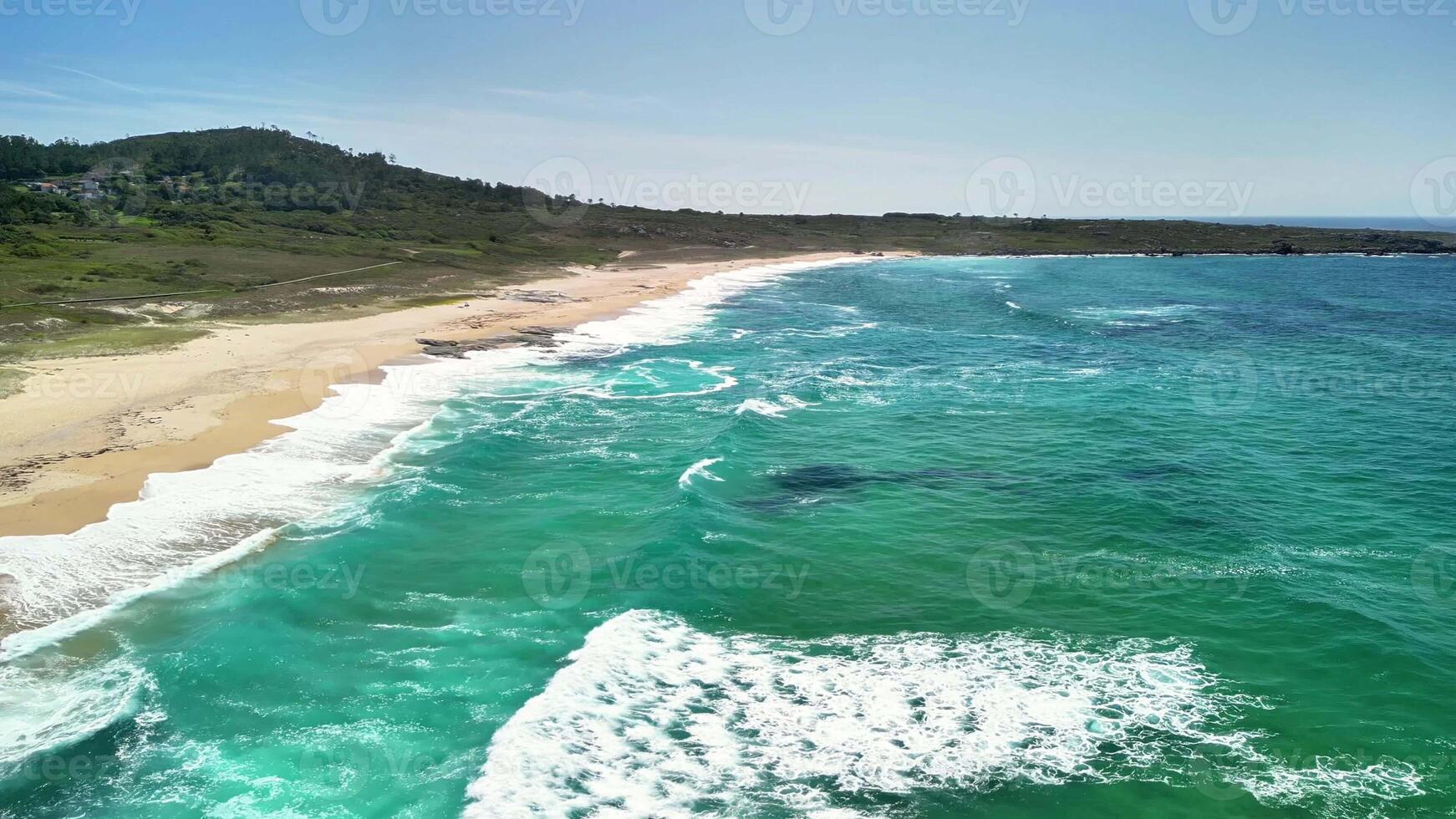 This stunning aerial shot captures a tranquil beach scene with vibrant turquoise waters and beautiful golden sand photo