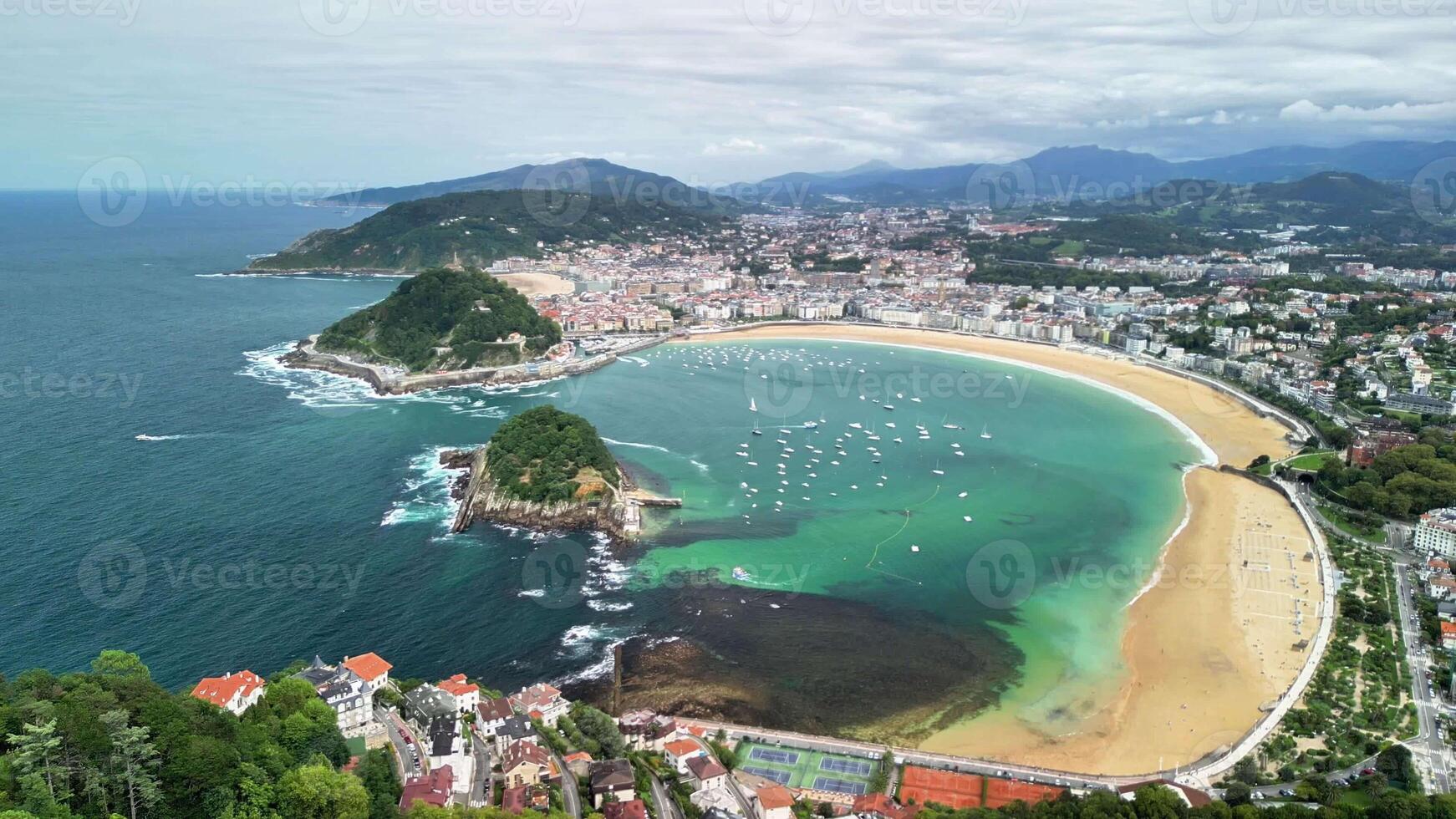 A stunning aerial shot captures a breathtaking view of a beautiful bay with sparkling waters and golden sandy beaches photo