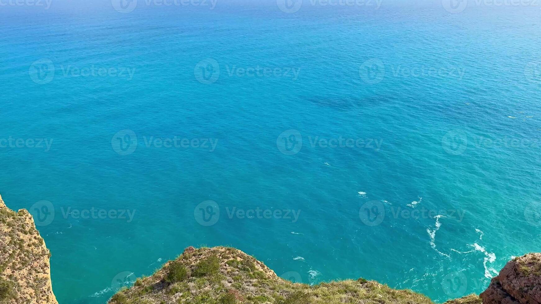 Breathtaking views of majestic cliffs dramatically meeting the clear blue ocean, perfect for all nature lovers photo