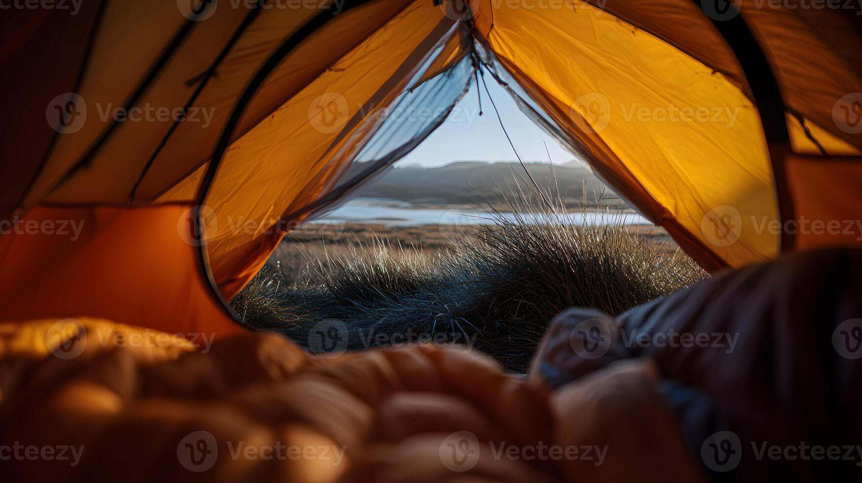 Waking up to a serene landscape a morning view from the warm comfort of a tent in nature photo