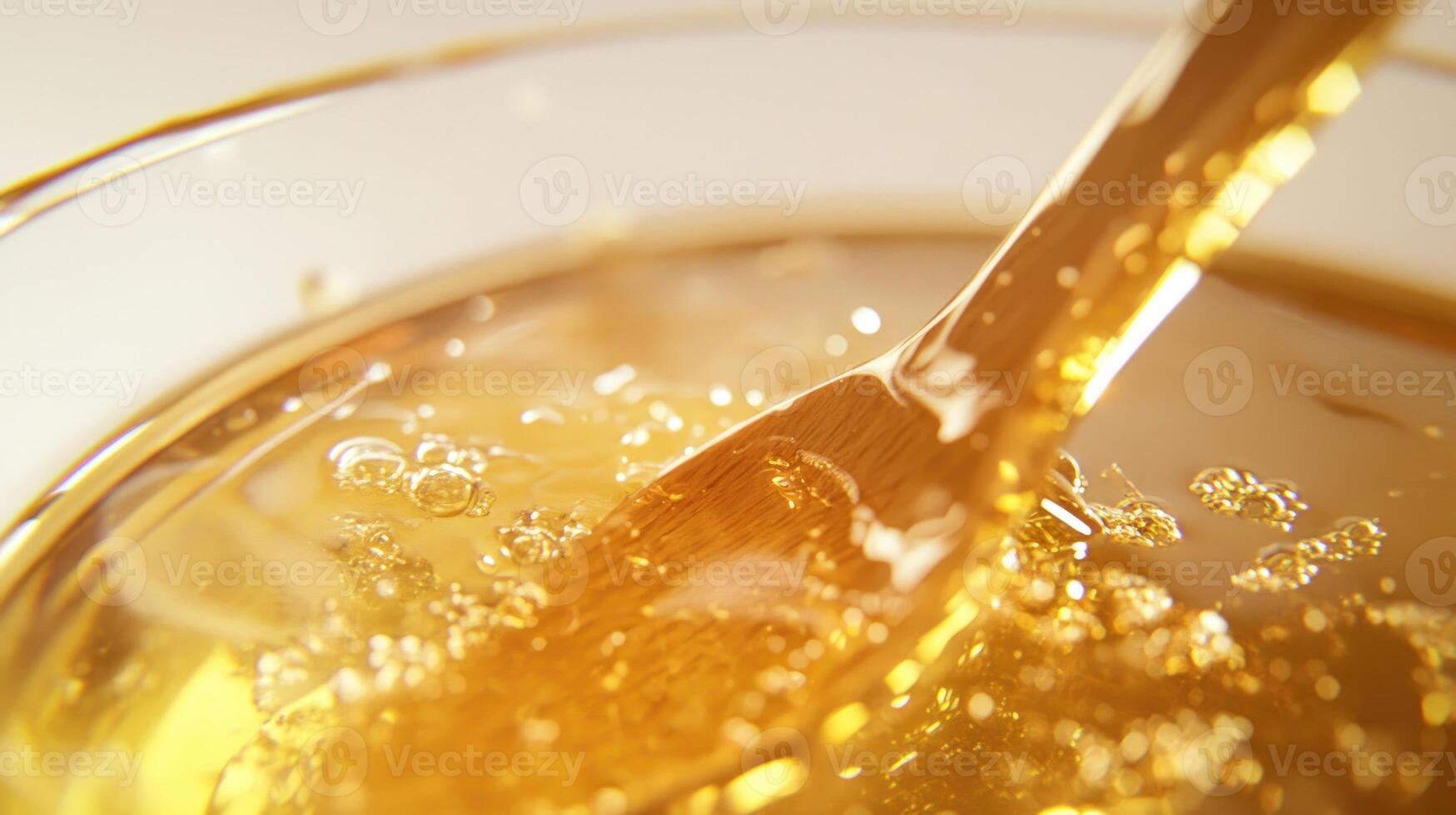 A spoon is in a glass of liquid photo