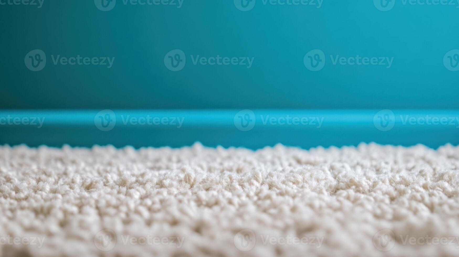 A close up of a carpet with blue walls photo