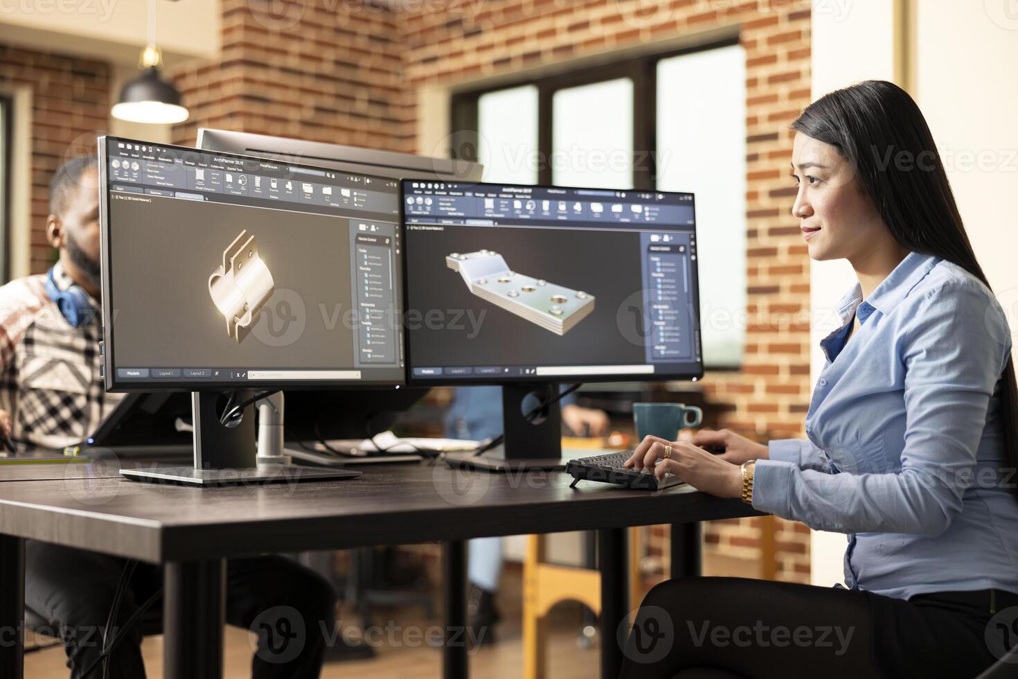 Professional female engineer manufacturing machinery models with advanced CAD software. Asian woman technician sitting at desk and designing mechanical products on a digital interface. photo