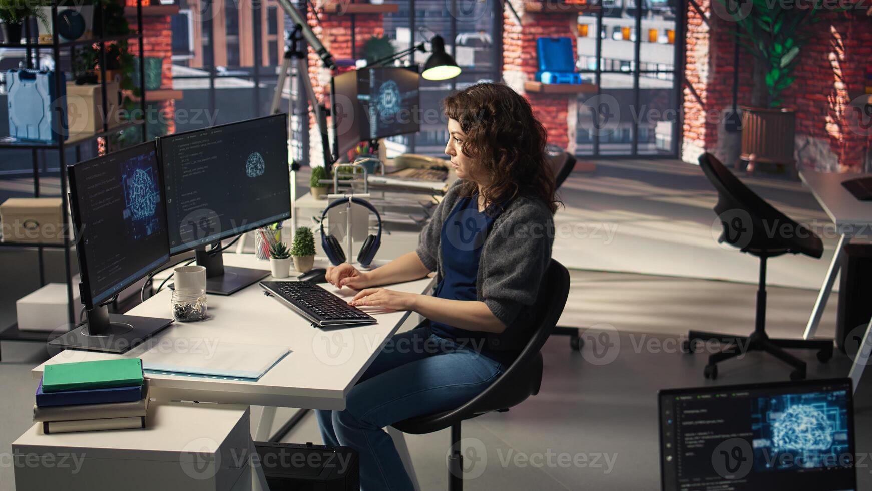 Woman IT developer using pc setup for artificial intelligence cloud computing through self learning algorithms. Agency system engineer works with AI deep neural networks on desktop. Camera A. photo