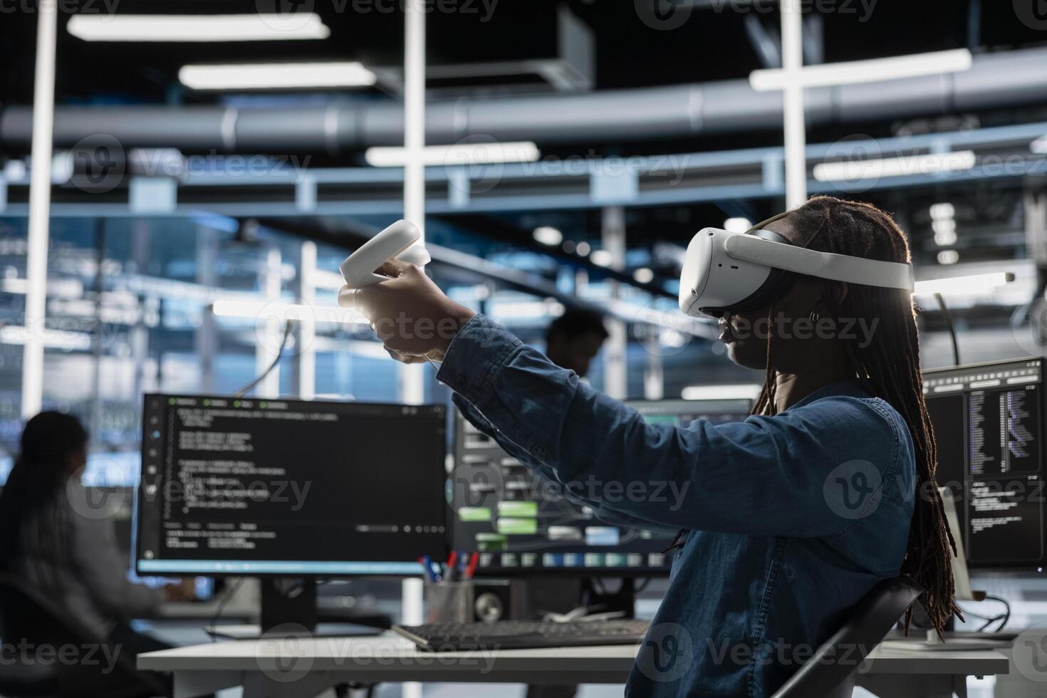 Data center developer uses VR headset and AI technology for machine learning workloads. Server hub specialist using virtual reality and artificial intelligence to perform demanding computing tasks photo