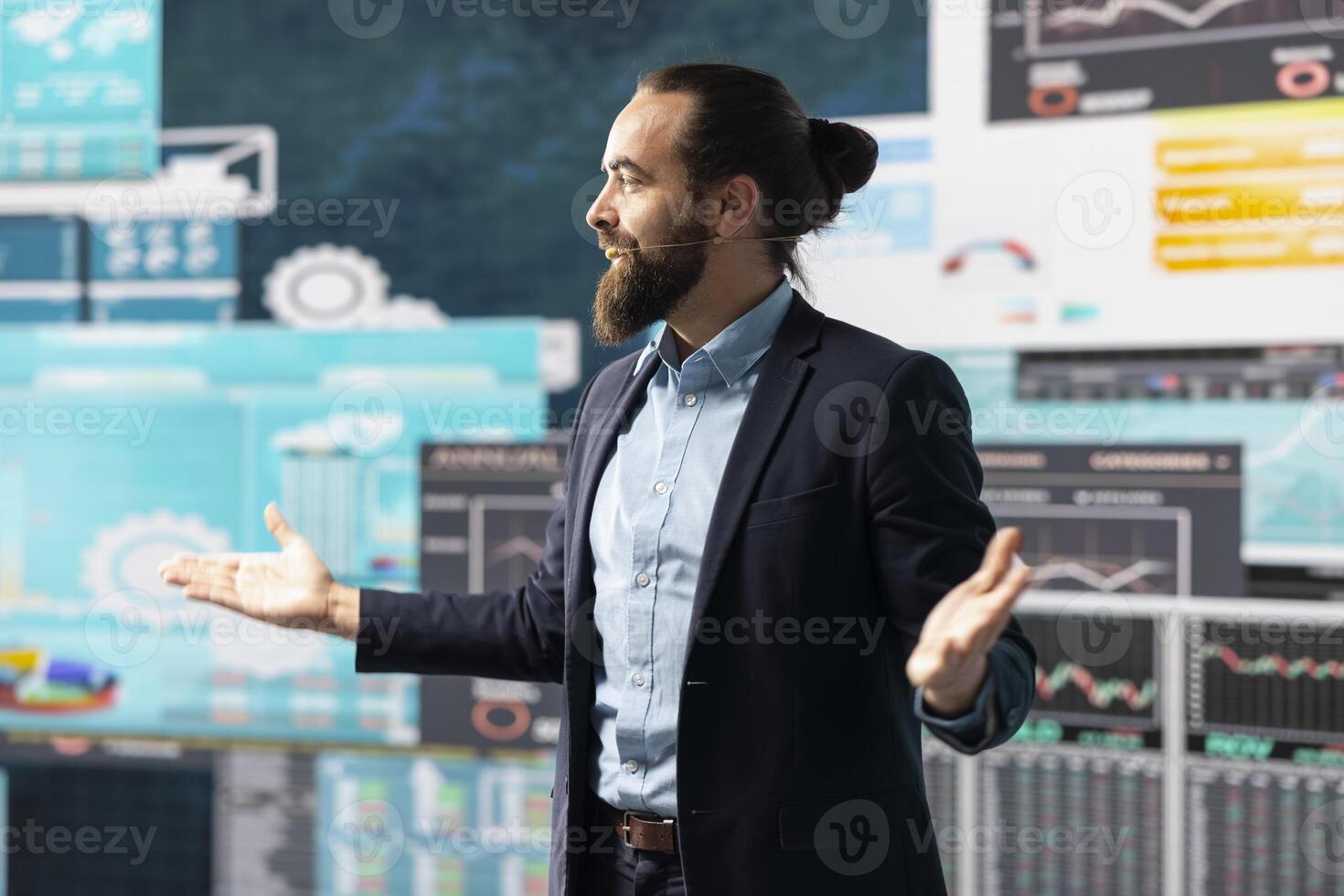 Public speaker CEO hosting business presentation to share a vision, discussing about new growth strategy and ideas for global development. Using a hands free microphone for attendees. photo