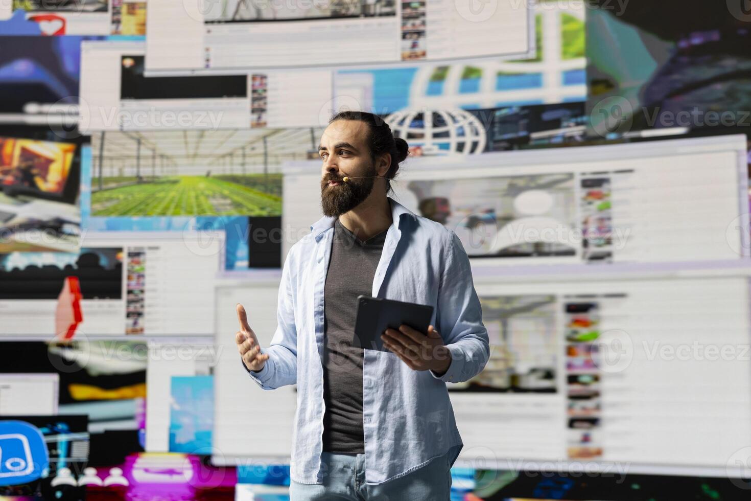 Young man speaker discussing with the audience during a live social media event, showcasing innovation and real time interaction to ensure engagement and online presence, brand voice. photo