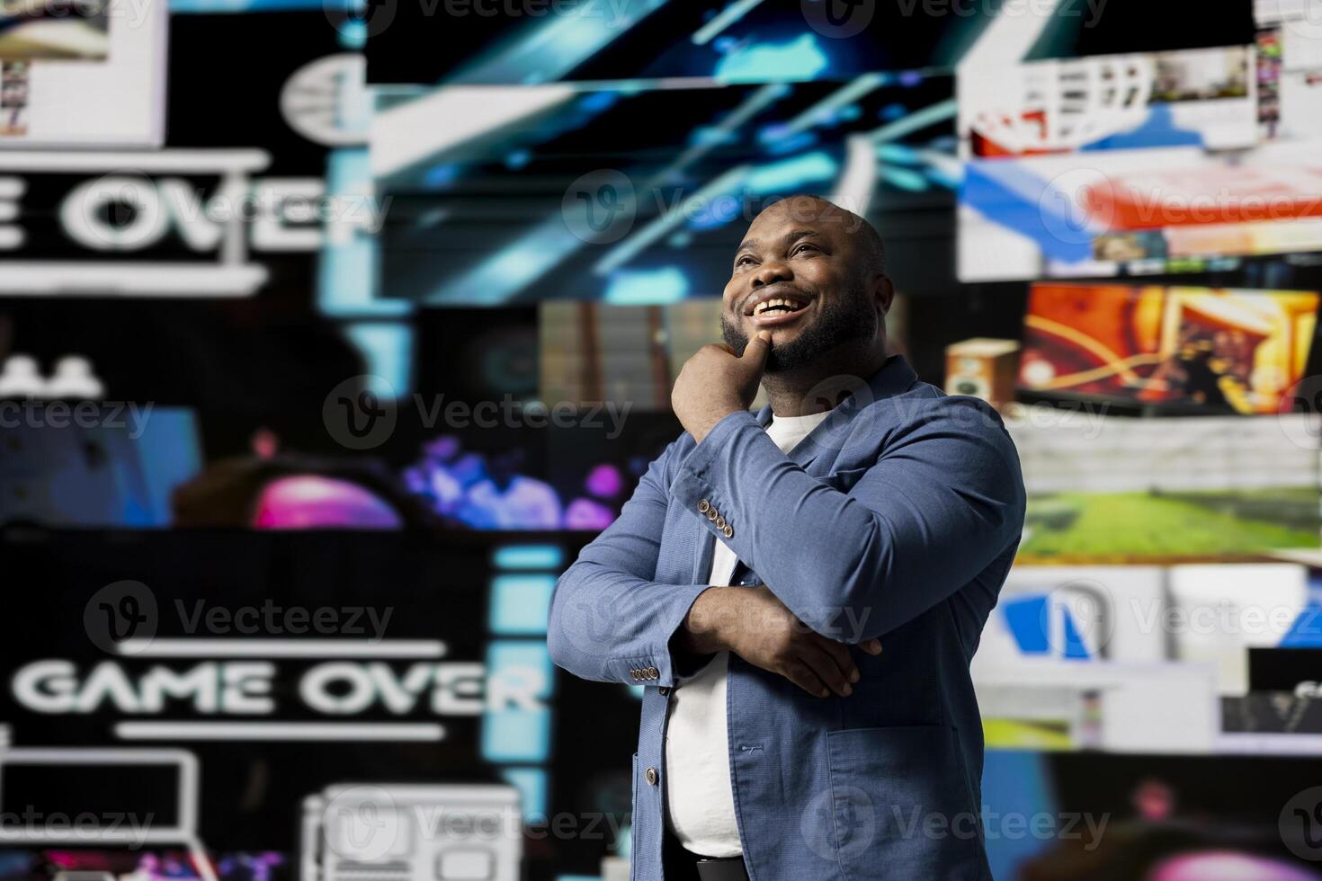 African american young guy connected to a global network through mobile devices, opening apps and streaming services platforms. Emphasizing communication and user interface evolution. photo