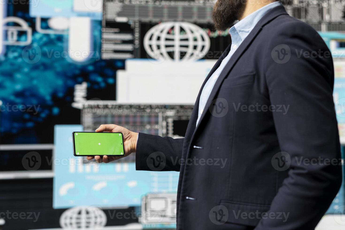 Businessman looks at green screen on phone for annual trends, planning a strategy for corporate success. Analyzing reports and infographics performance metrics to improve activity. photo
