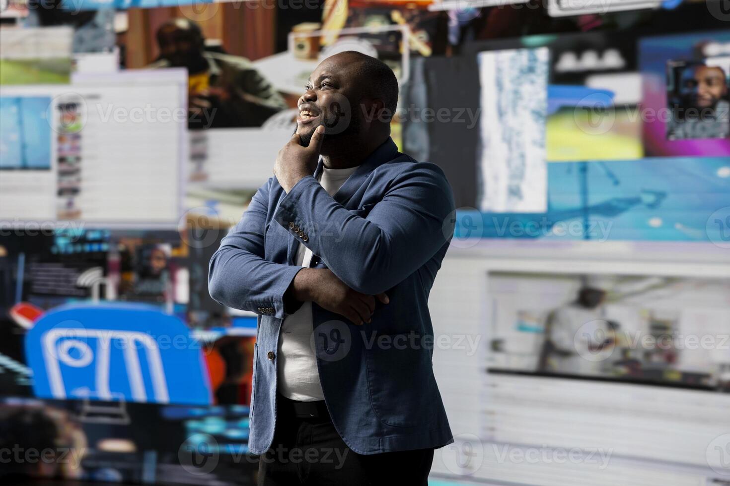 Smiling african american influencer being connected on vibrant digital interfaces and visualizations, representing mobile content creation, global reach and social network web experiences. photo