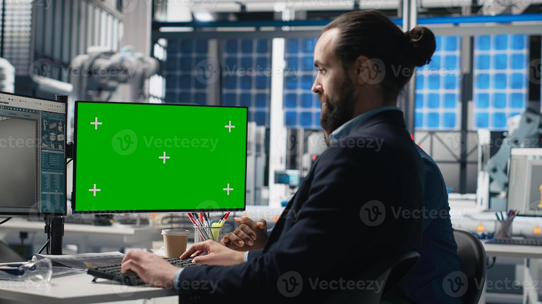 Solar panels inspection group review data on pc next to green screen, finding errors during a process audit and helping optimize renewable energy operations. Photovoltaics factory. Camera B. photo
