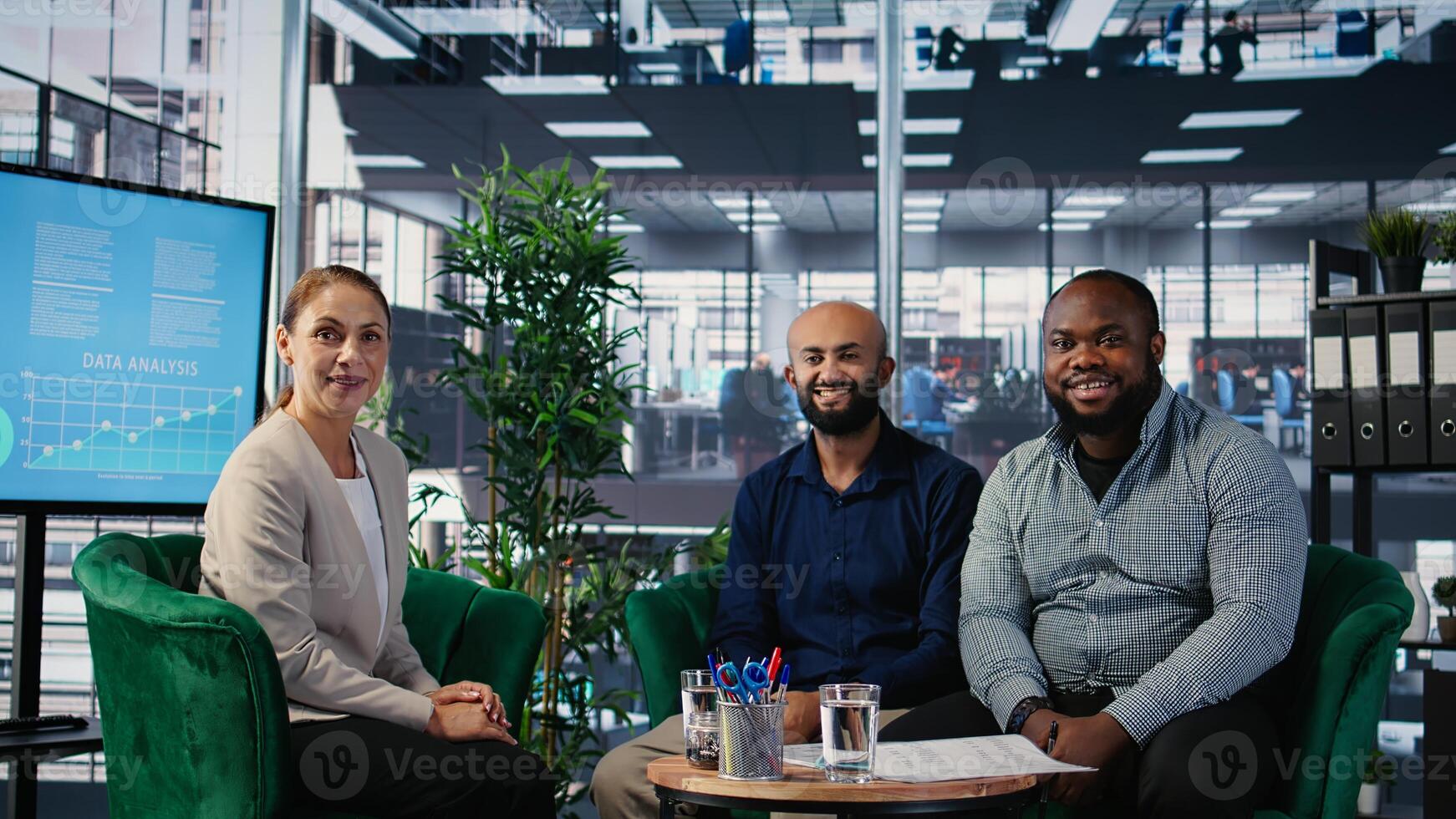 Group of diverse business partners meeting for a new contract negotiation, working together for a global development. Associates analyzing insights and annual reports in a briefing. Camera A. photo