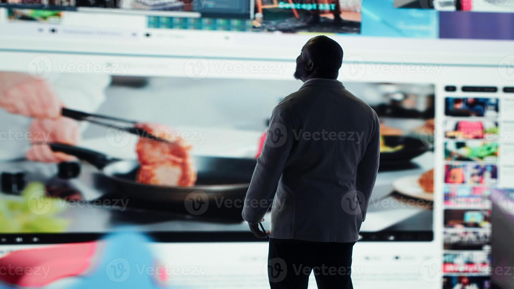 Happy person typing on phone touchscreen, relaxing with curated digital content. Joyous man browsing social media apps on smartphone in front of interactive dashboard in modern setting, camera A photo