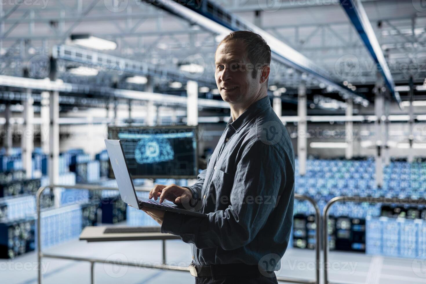 Portrait of smiling engineer in AI data center monitoring error logs for debugging processes. Cheerful employee in server farm reviewing code for artificial intelligence based automation scripts photo