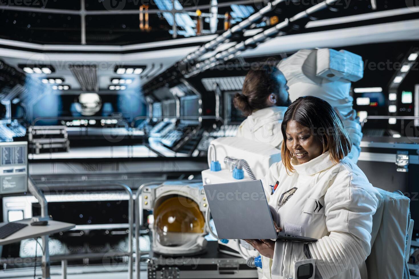 Female astronaut in spacecraft verifying navigation coordinates using laptop device. Woman in spaceship updating flight log on notebook during planetary exploration flight photo