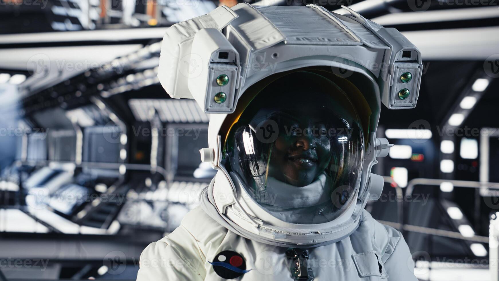 Portrait of joyful astronaut putting cosmic protection equipment on, doing human expansion in space. Radiant cosmonaut mapping unknown worlds during mankind survival expedition to Mars photo
