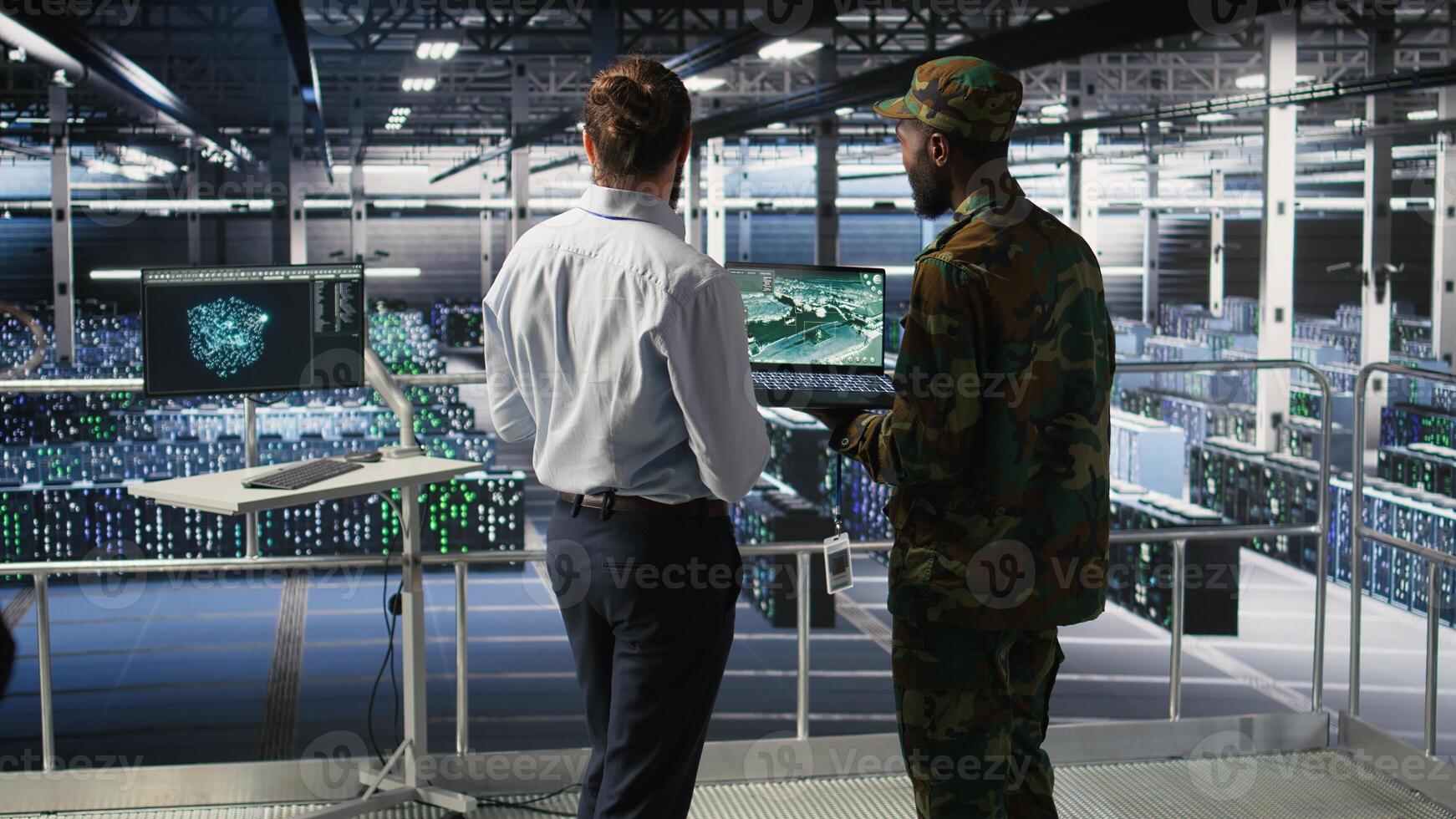 Military IT specialists in server hub using laptop scanner tools to oversee battlefield during warfare. Army data center admins doing transmission analysis and live UAV system monitoring photo