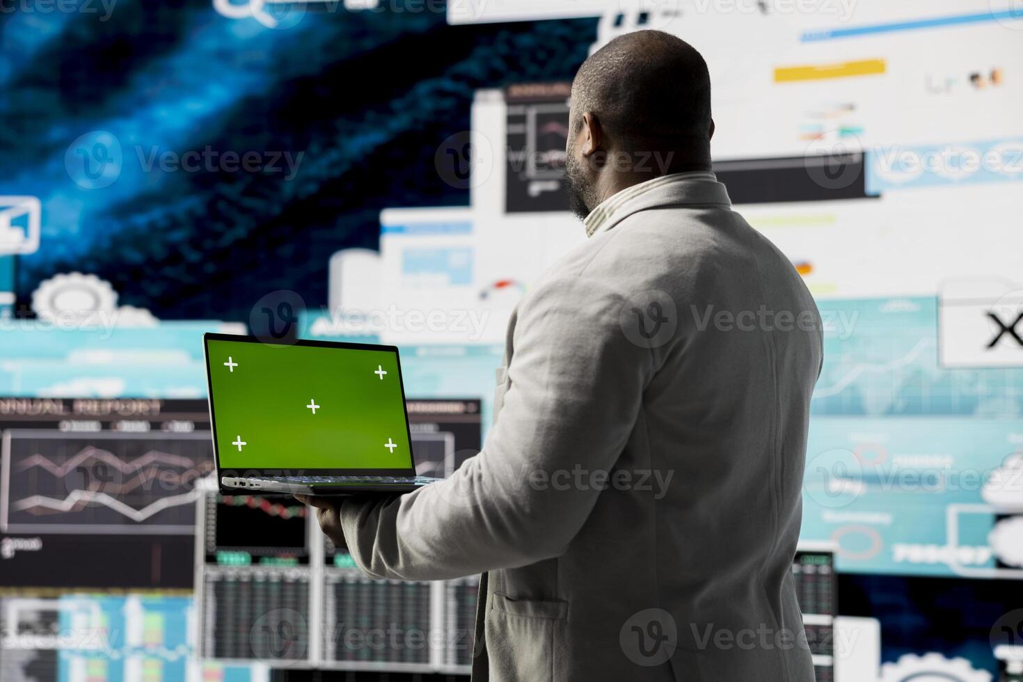 Black executive manager studying copy space screen with data insight for business growth, surrounded by virtual graphs and forecasting models. Financial performance and decision making. photo