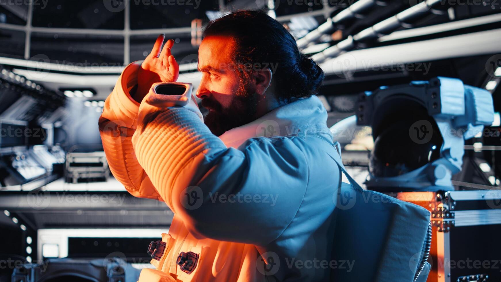 Man doing planet colonization reacts to extraterrestrial presence hovering near space station. Starship glowing as cosmonaut watches alien vessel approach while gathering stellar data photo