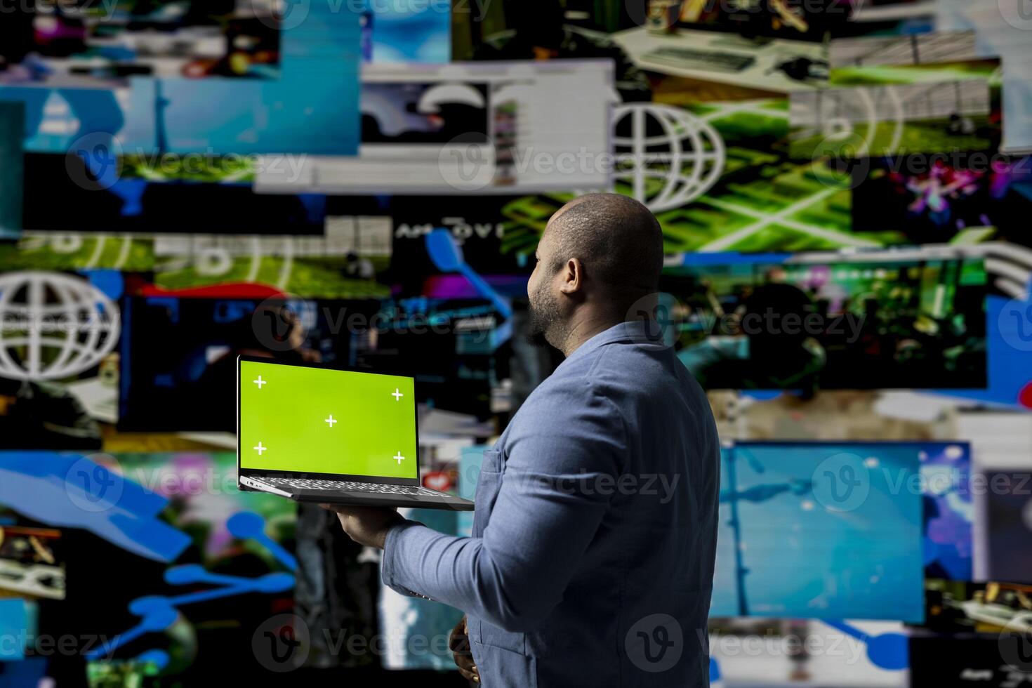 Professional content creator in a multitasking space holds green screen, leveraging social media, internet big data and cloud systems. Engaging followers to boost digital presence. photo
