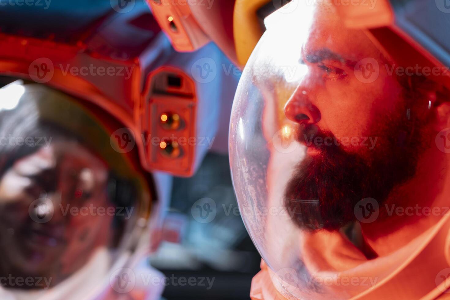 Close up of orbit station coworkers wearing helmet to protect against hazard, troubleshooting red light alert. Spaceship astronauts wearing protection gear against space radiation photo