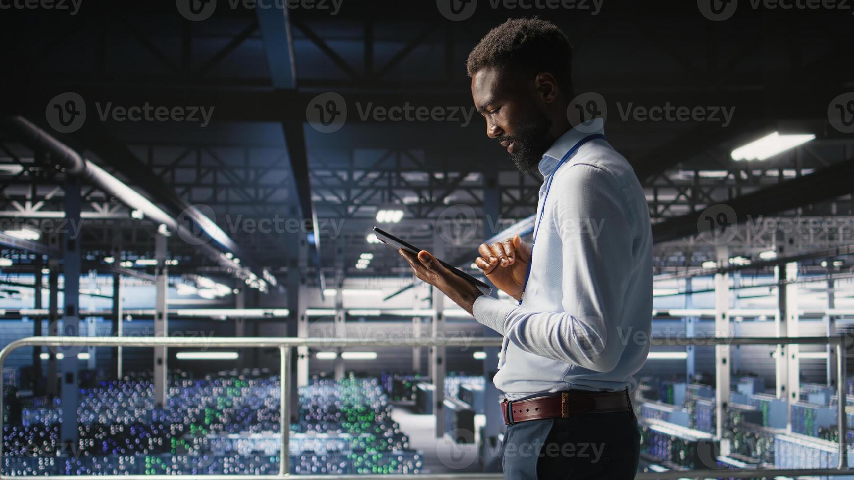 Admin on data center industrial platform analyzing infrastructure performance outputs on tablet. Server room employee doing job tasks, finetuning mainframes configurations, photo