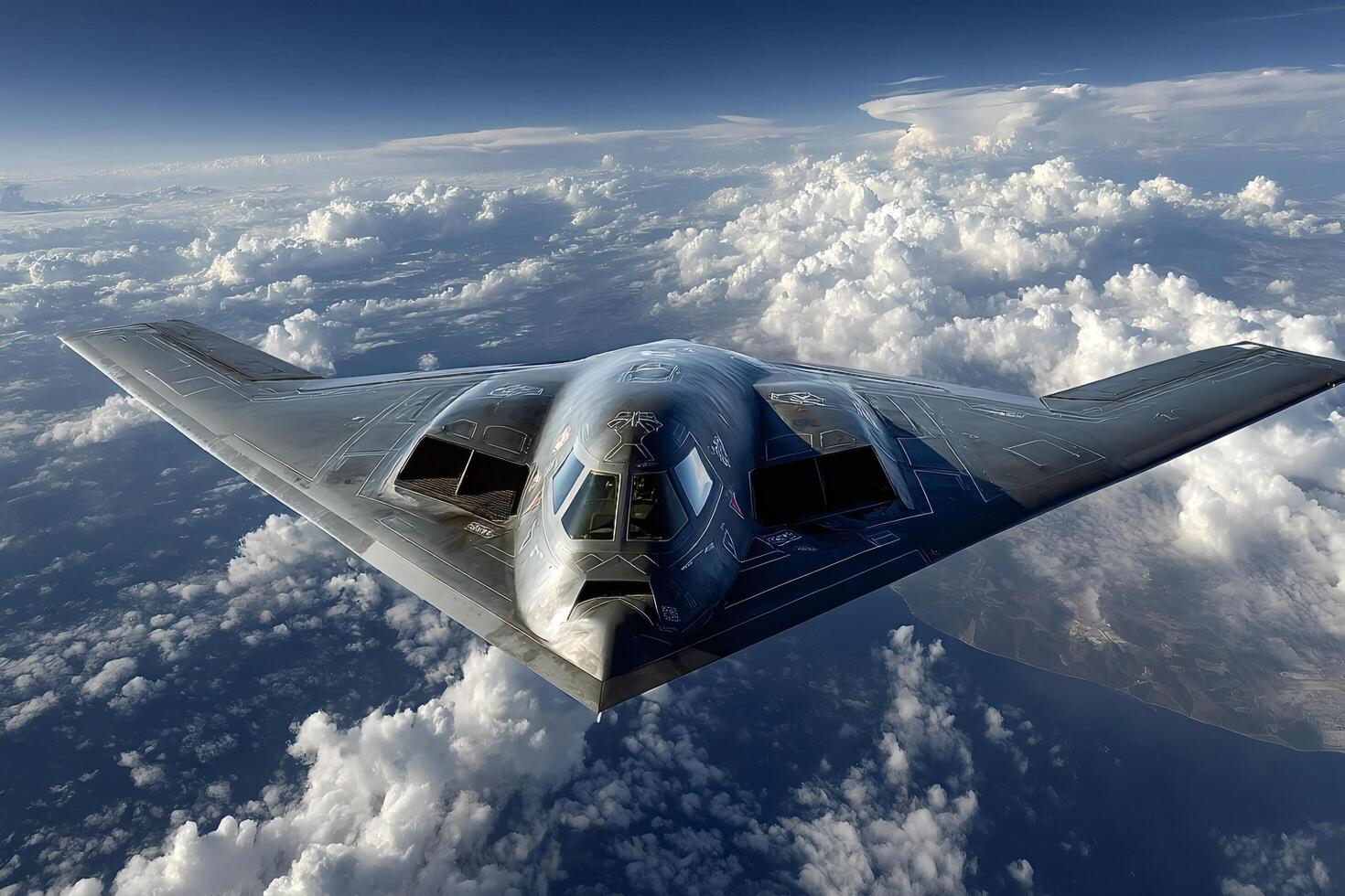 Northrop grumman b 2 spirit stealth bomber flying over clouds photo